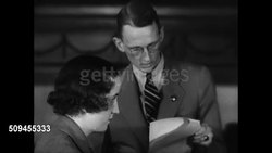 1936: FUTURE VETS OFFICE: Male hands opening letters. Male dictating letter, female typing. Young adult males typing. CU Male fingers typing on typewriter. Looking over letters. Instructional Video