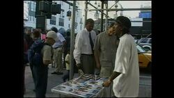 Pavement seller selling 9/11 posters News Clip