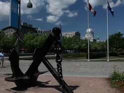 MS TU Anchor, quebec and canadian flag and tourists walking at old port / Montreal, Quebec, Canada Stock Footage