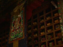 Pan right reveal Buddha in Trugo Monastery Lhasa Tibet China Stock Footage