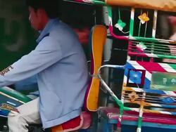 MS TS SLO MO Shot of young woman sitting in back of tuk tuk / Luang Prabang, Laos Stock Footage