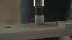 Drilling a hole in a piece of wood Stock Footage