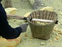 MS Miner working on the sulfur extraction at Ijen volcano crater / Ijen, Java, Indonesia Stock Footage