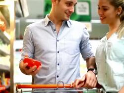Two people buying cheese in supermarket. Stock Footage