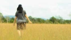 young woman is cheerful on Savannah field Stock Footage