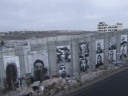 MS Shot of Grimacing wall (warning maybe copyright on this poster) / Palestinian Wall, Israel, Israel Stock Footage