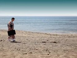 Japanese woman carrying heavy suitcase Stock Footage