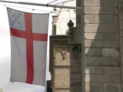 MS TD A religious flag hanging from church exterior / New York City, New York, United States Stock Footage