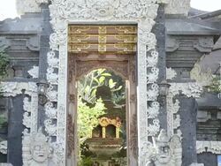 MS TD Temple guardian in front of house entrance door like temple / Ubud, Bali, Indonesia    Stock Footage