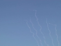 Rocket fire vapour trails in sky over Gaza News Clip