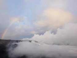 WS T/L View of rainbow appearing above Volcanic steam plume / Big Island, Hawaii, United States Stock Footage