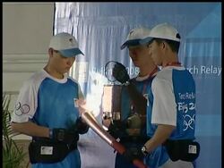 Thousands cheered the Olympic torch in Vietnam's largest city on Tuesday, marking the final leg of an international tour that has been dogged by protests against China News Clip