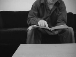 Reading the Bible (Grungy B&W) (NTSC) Stock Footage