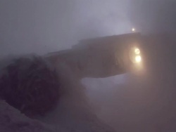 CU Machine grinding away at wall of salt mine creating dense cloud of salt dust / Sicily, Italy Stock Footage