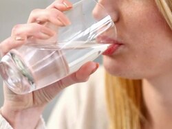 Woman drinking water. Stock Footage