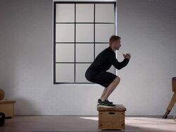 Man doing his workout in gym (squat straight jump) Stock Footage