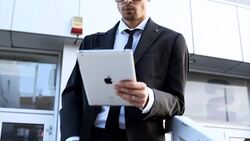 Using tablet outside of work Stock Footage