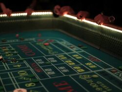 Casino footage, gambling chips and dice on craps table Stock Footage