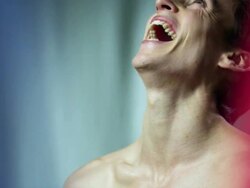 Man laughing with French flag in background Stock Footage