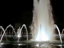 Static shot of the World War II fountain illuminated at night in Washington DC Stock Footage
