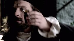 Nostradamus taps a powder out of a jar and onto a scale. Stock Footage