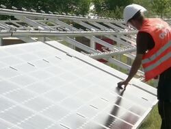 MS Model fitting instillation screws on line of panels / Howbery, Oxfordshire, United Kingdom Stock Footage