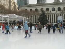 WS Shoppers passing by stores in Bryant Park during winter / New York City, New York, USA Stock Footage