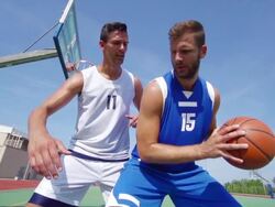 HD: Wide Shot of Young Man Making a Basket Stock Footage