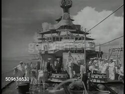 1940: DUTCH NAVY PREPARES: Naval Headquarters port Surabaya, E. Java. Naval officer at desk handing paper to another. Dutch sailors washing deck of warship. Naval officers under ships awning. VS Dutch East Indies Squadron warships docked in ports. Instructional Video