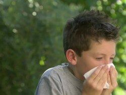 Boy sneezing Stock Footage