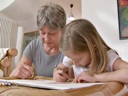 HD: Adorable Girl Drawing With Her Grandmother Stock Footage