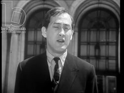 Daniel Dorian presenting to the camera outside the Detroit Institute of Arts in Michigan, USA, 1965 Stock Footage