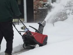 Snowblower Clearing Sidewalk Stock Footage