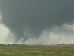 WS View of tornado whirls over green field / Tillman County, Oklahoma, United States Stock Footage