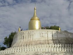 MS LA Shot of Bupaya temple with golden stupa at Ayeyarwady river with people / Bagan, Mandalay Division, Myanmar Stock Footage