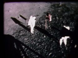high angle of Neil Armstrong + Buzz Aldrin by US flag on Moon Stock Footage