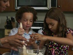 Slow motion of girl cracking egg on side of bowl. Stock Footage
