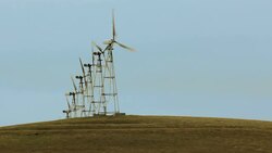 Wind Turbines generating electrical power on Agricultural Land Stock Footage