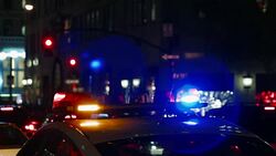 Police car with turned on siren at night street Stock Footage