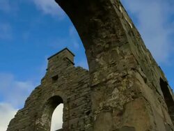 Time-Lapse Tilt down stone arch of slatemill ruin with clouds  Stock Footage