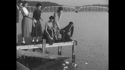 Lenoir-Rhyne College students toss bottles into Lake Hickory in preparation for Operation Bottle News Clip