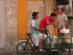 MS Travelers talking with local street vendor / Cartagena, Bolivar, Colombia    Stock Footage
