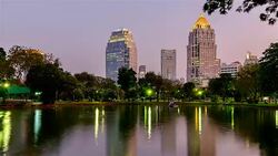 Day to Night Time lapse Building and sky in Lumpini Park Stock Footage