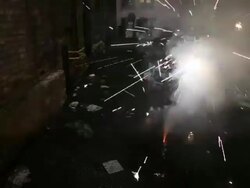 MS TU Two young girls having fun and lighting fireworks and sparklers at night in alley together / Minneapolis, Minnesota, United States Stock Footage