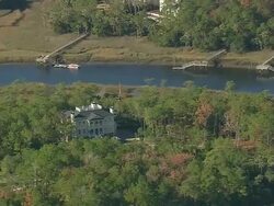 MS AERIAL Shot of farm house surrounded by Francis Marion Forest with lake / South Carolina, United States Stock Footage