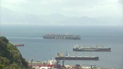 Cargo ships and Navy ship in Gibraltar News Clip