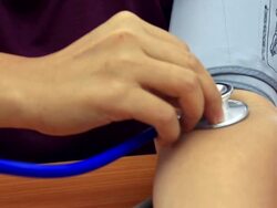 HD crane shot: blood pressure test Stock Footage