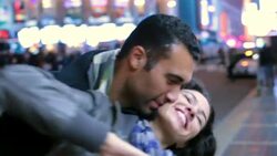 Young couple embrace and dance in the street in Times Square Stock Footage