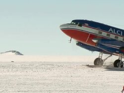 WS PAN of DC-3 plane taxiing for taking off in snow / Union Glacier, Heritage Range, Ellsworth Mountains, Antarctica  Stock Footage