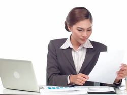 business woman working with papers and laptop Stock Footage